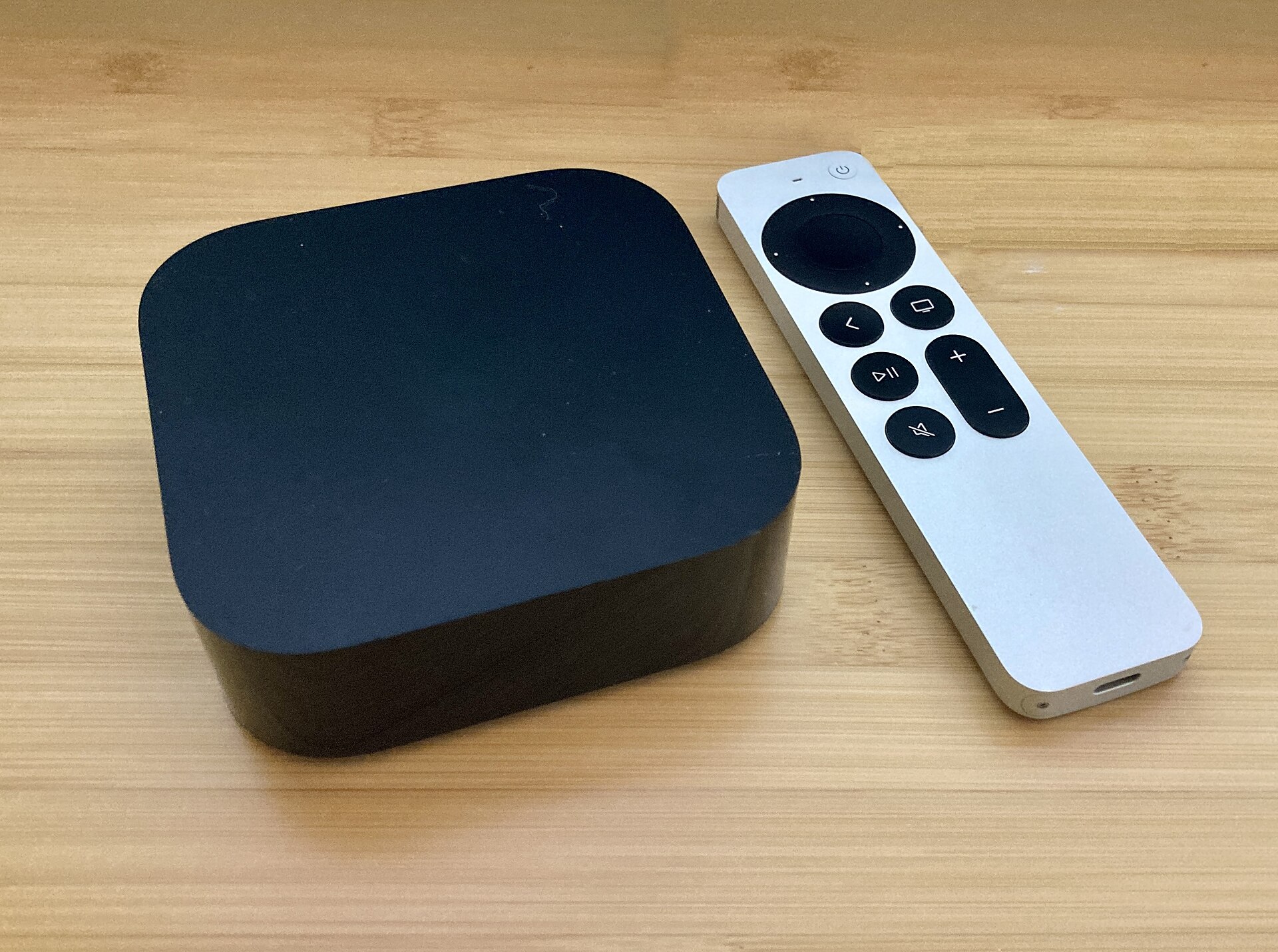 The fourth-generation Apple TV 4K streaming box and its Siri Remote
