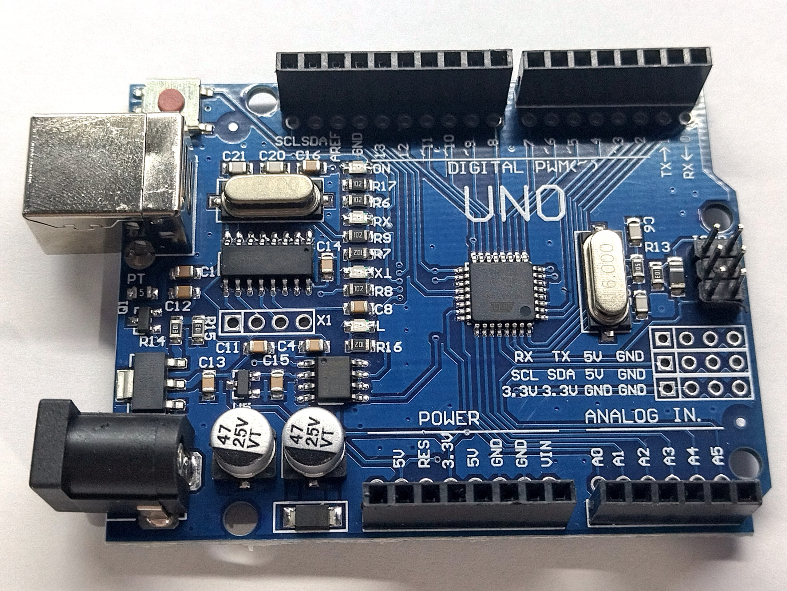 An Arduino Uno board photographed from above, showing the pin headers and microcontroller