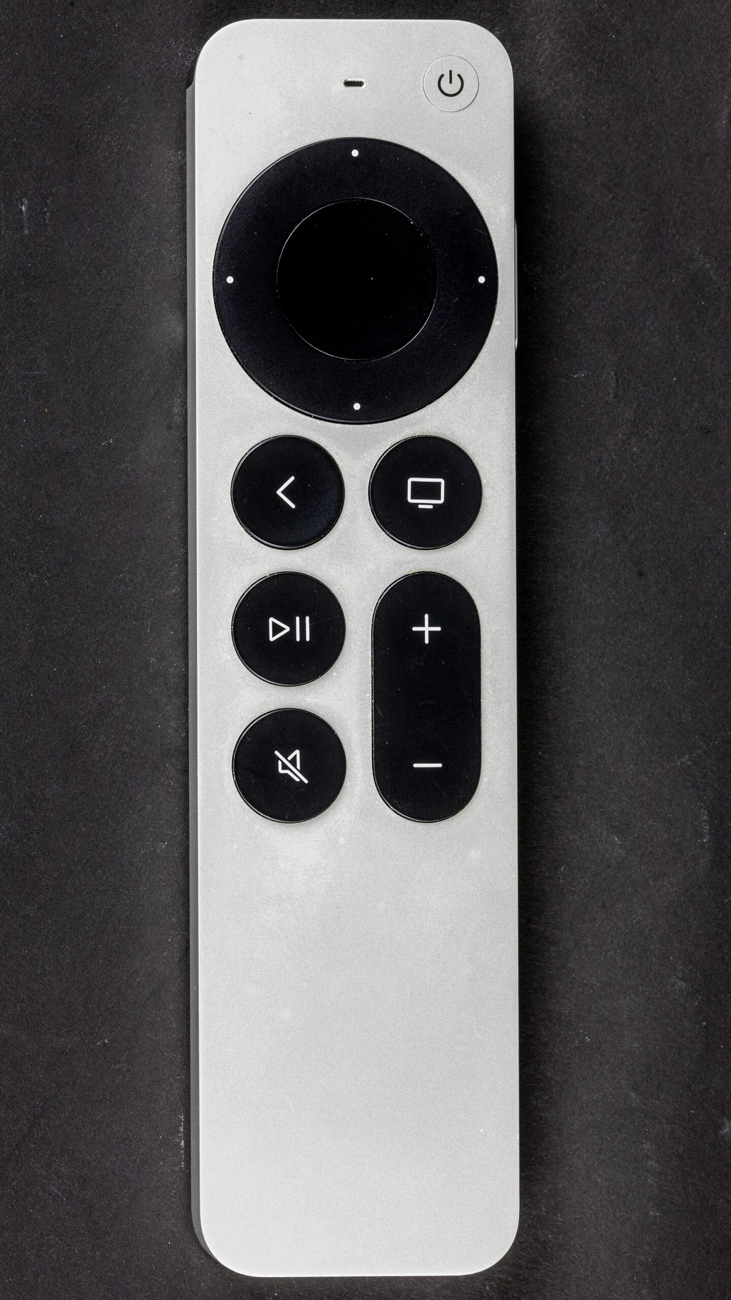 The Apple Siri Remote with its touch surface and side Siri button
