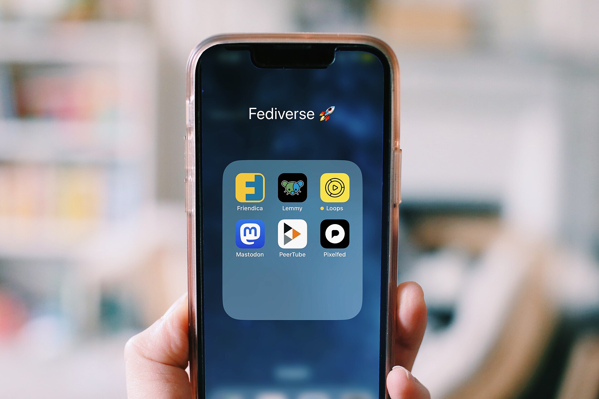 A smartphone displaying social media applications, illustrating social platform feature updates
